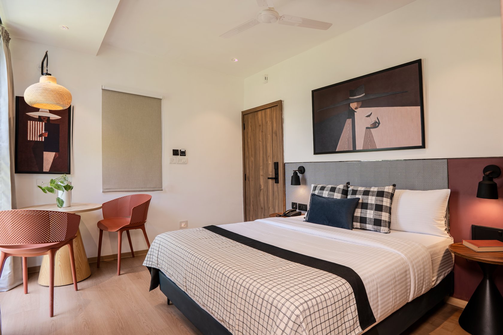 Deluxe Double Room at The Roost — queen bed, art print and a window-side table for two