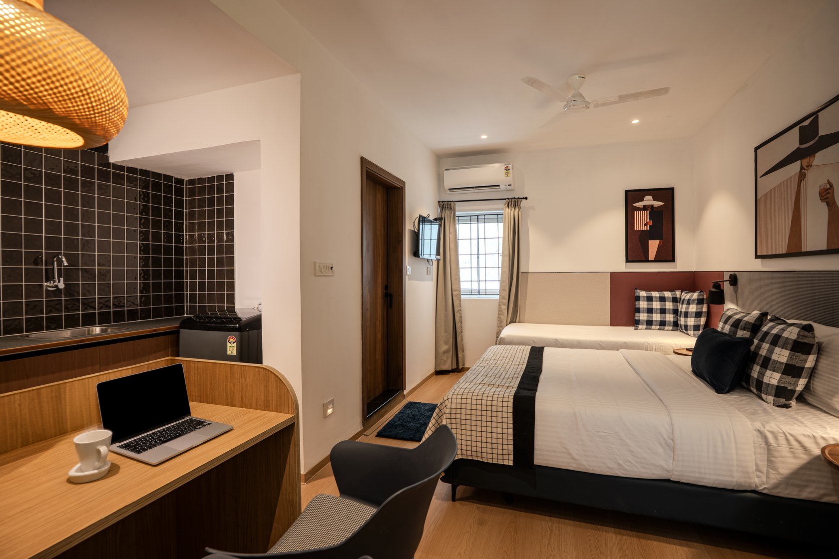Studio Room at The Roost — bed, workspace and kitchenette